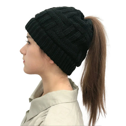 Women’s Belro winter knit beanie with a built-in ponytail hole, soft knit fabric, and cozy fit, ideal for cold weather.