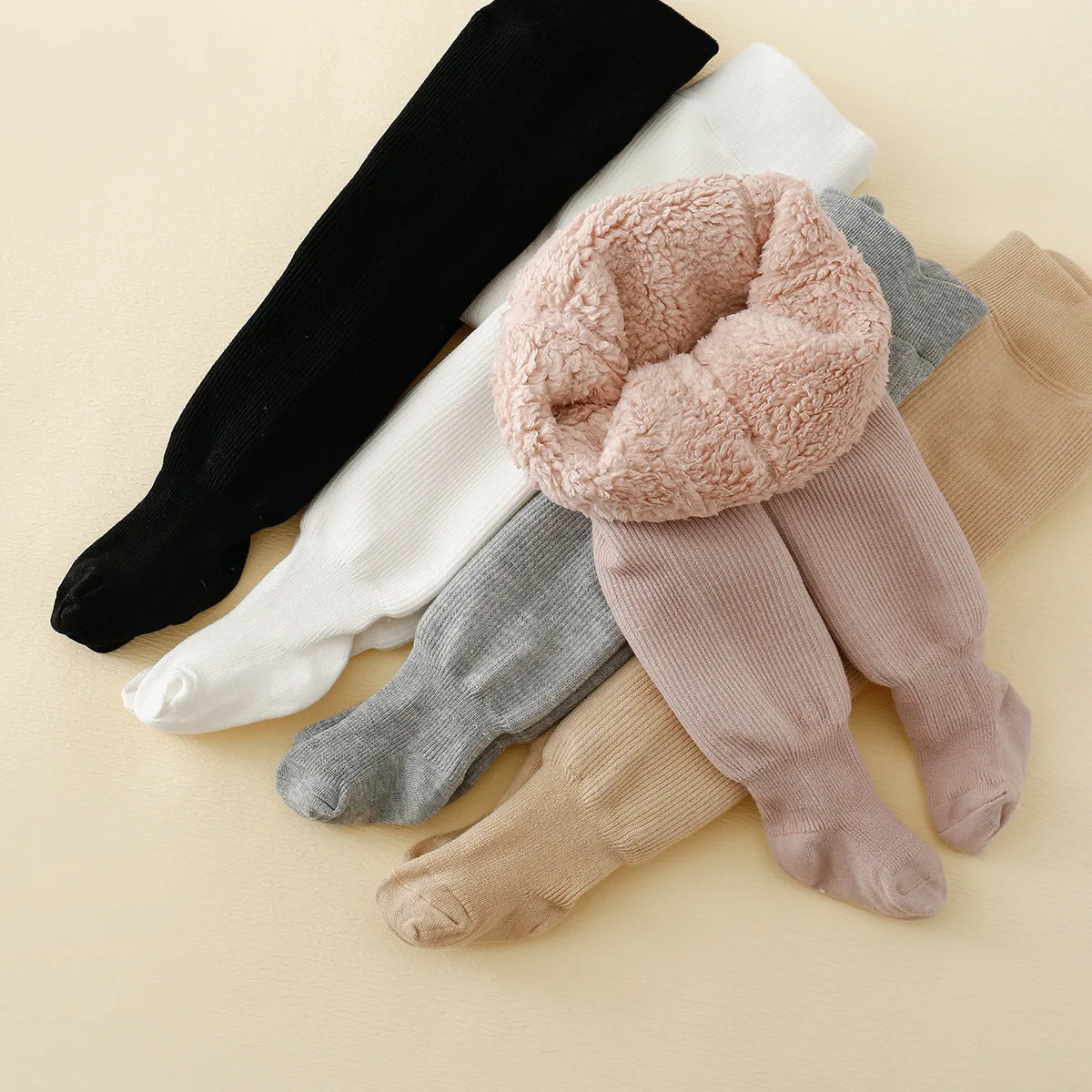 Kids winter fleece-lined leggings by Belro, soft and warm clothing with stretchy fabric for comfortable winter wear.