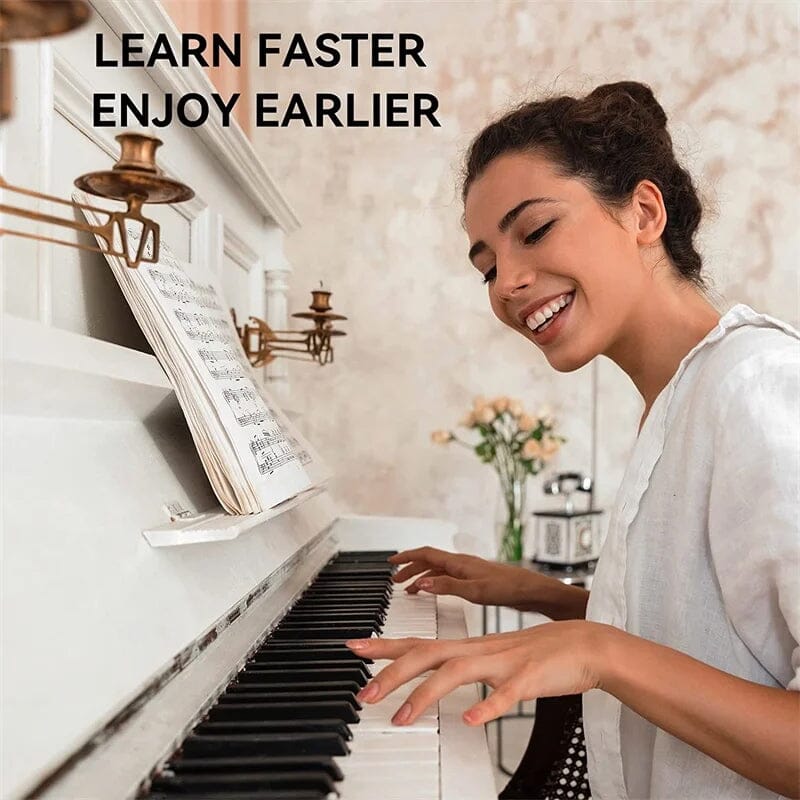 Color-coded BowLift removable piano keyboard note labels on a keyboard, showing easy-to-apply learning stickers for beginners.