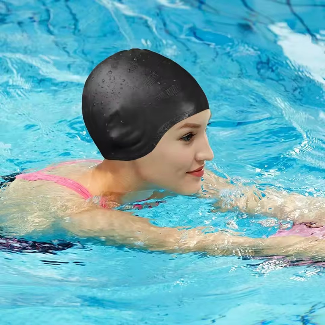 Black silicone swim cap with ear protection by BowLift, designed for waterproof swimming and comfortable fit.