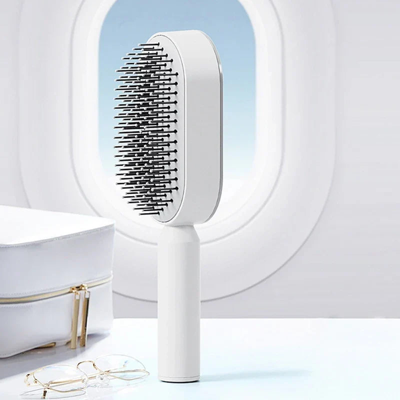 Belro self-cleaning hair brush with ergonomic handle and bristles, designed for easy hair detangling and cleaning.