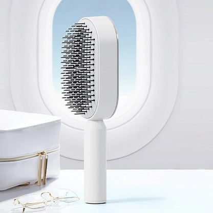 Belro self-cleaning hair brush with ergonomic handle and bristles, designed for easy hair detangling and cleaning.