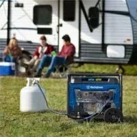 Westinghouse WGen5300DFcv 5300W dual-fuel portable generator with RV outlet and CO sensor, shown with open panels and control panel.