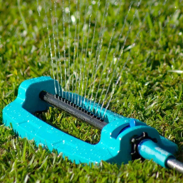 Belro wide range oscillating garden sprinkler system watering lawn outdoors, adjustable water spray for garden irrigation