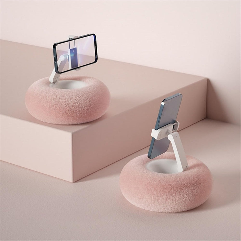 Belro fuzzy pillow phone holder with snack bowl on a table, showcasing a cozy, multifunctional phone mount and snack container.