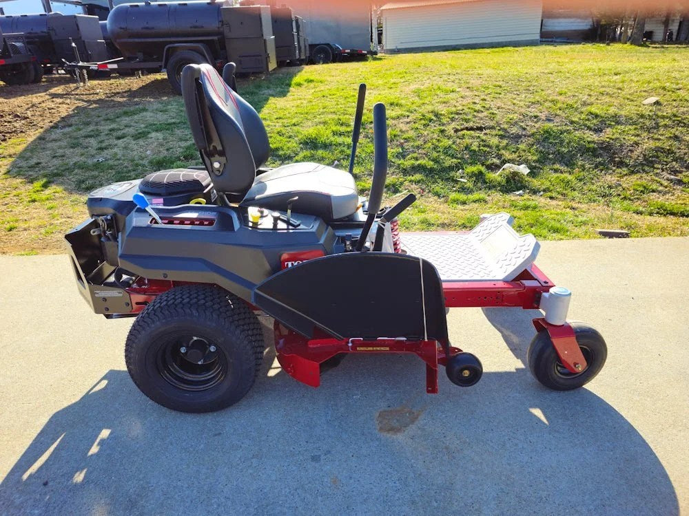 Toro 75747 42-inch TimeCutter MyRide zero-turn mower with 22HP Kohler engine, shown in a grassy yard setting