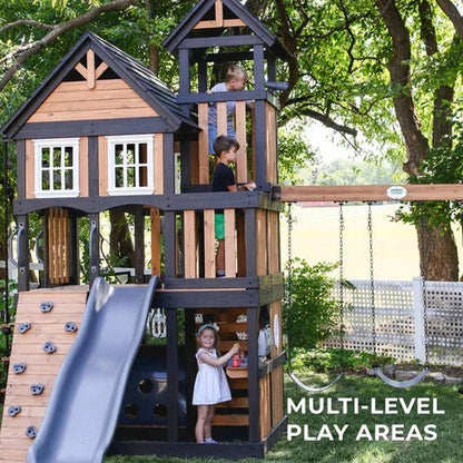 Casavibeo Backyard Discovery Mystic Tower Swing Set with climbing frame, slides, and swings in a backyard playground setup.