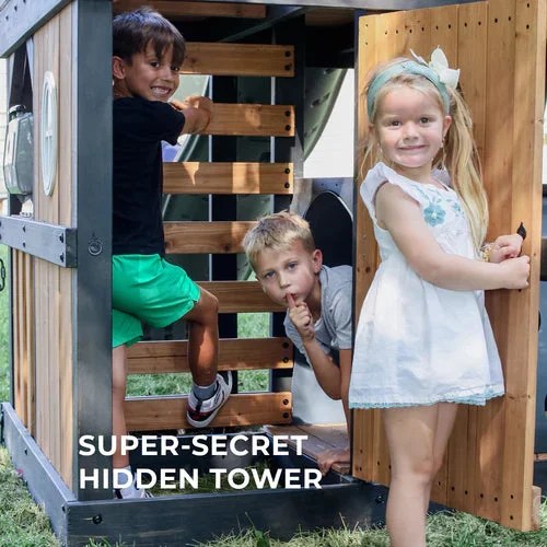 Casavibeo Backyard Discovery Mystic Tower Swing Set with climbing frame, slide, and swings in a backyard setting.