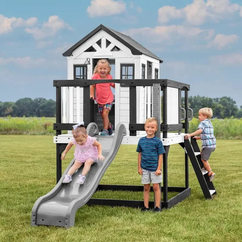 Casavibeo Backyard Discovery Sweetwater Heights elevated playhouse with a wooden design, slide, and play area for children.