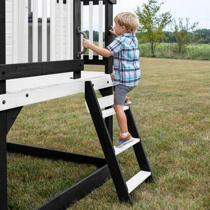 Casavibeo Backyard Discovery Sweetwater Heights elevated playhouse with slide and climbing features in a backyard setting