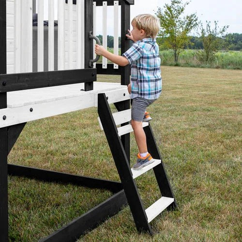 Casavibeo Backyard Discovery Sweetwater Heights elevated playhouse with slide and climbing features in a backyard setting.