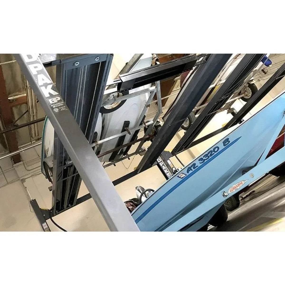 BendPak HD-7500BLX 7,500 lb capacity vehicle and boat storage lift with 82-inch rise, shown in an industrial garage setting.