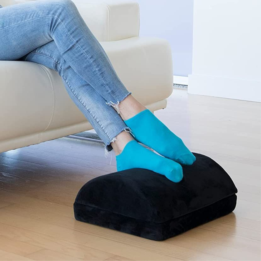 Belro curved ergonomic under desk foot rest designed for home office, providing comfortable foot support under workspace.