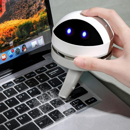Belro compact USB charging mini desk vacuum cleaner robot for electronics cleaning on a workspace.