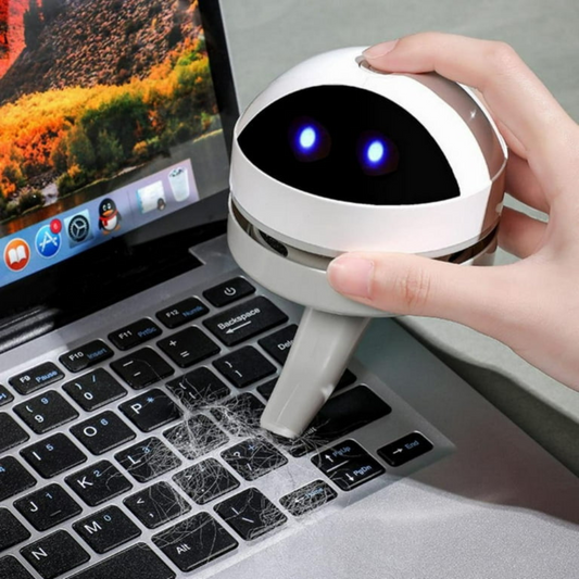 Belro compact USB charging mini desk vacuum cleaner robot for electronics cleaning on a workspace.