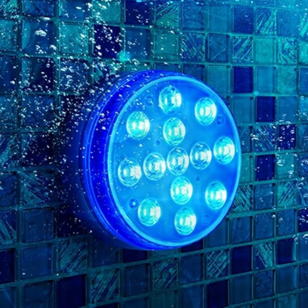 Colorful Belro submersible LED pool party lights illuminating a backyard pool with vibrant rainbow colors.