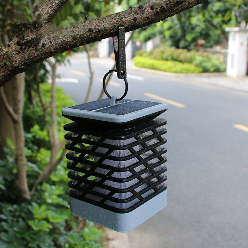 Belro Solar LED Garden Lantern illuminating a garden pathway with a warm glow, suitable for outdoor home and garden decor.