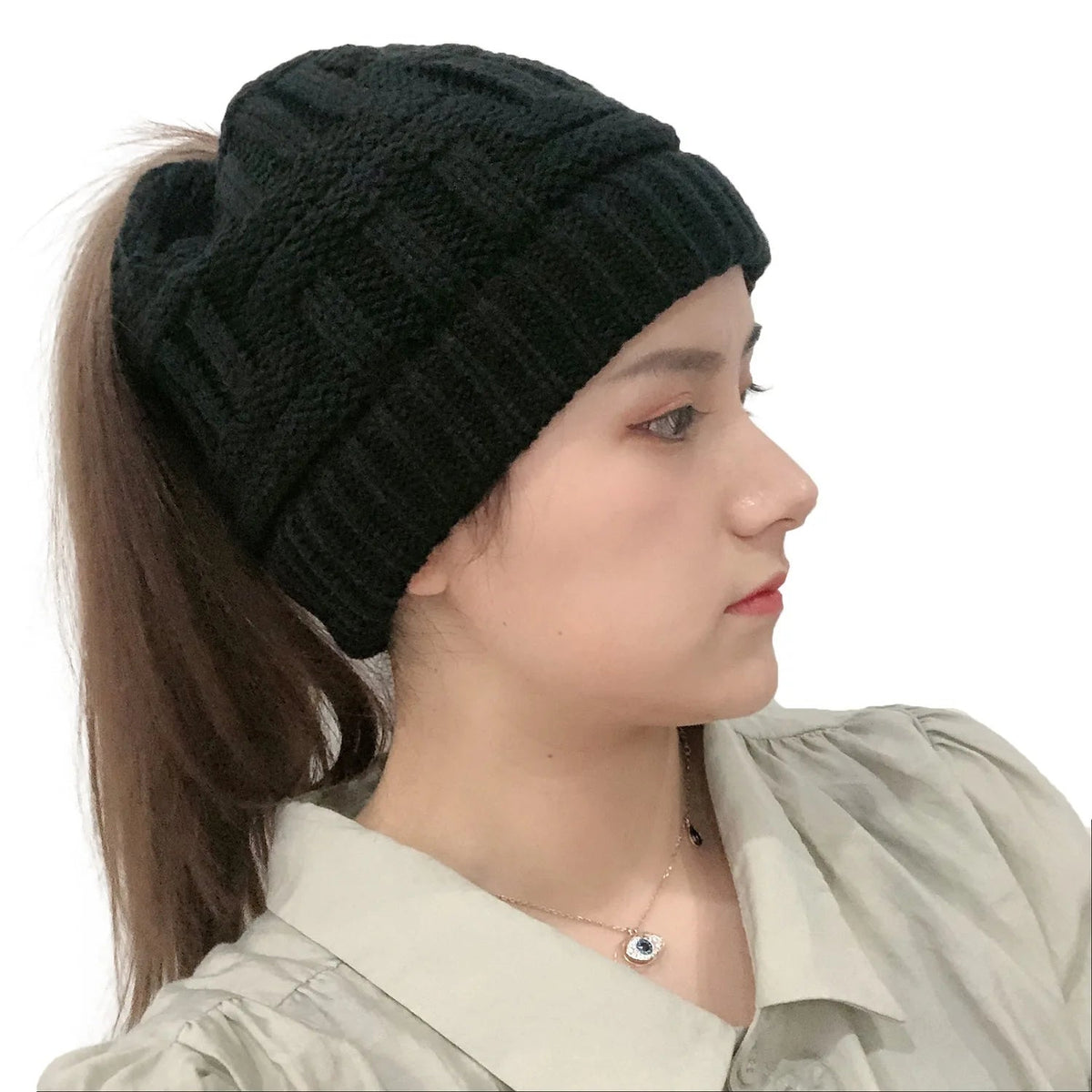 Belro women’s winter knit beanie hat with a ponytail opening, cozy and stylish for cold weather, made of soft knit material.