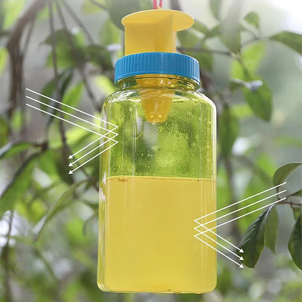 Reusable Belro fruit fly catcher bottle for outdoor pest control, shown filled with trapped fruit flies in a garden setting.