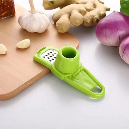 Belro manual mini garlic press and crusher with stainless steel chamber and handle for easy garlic mincing in kitchen.