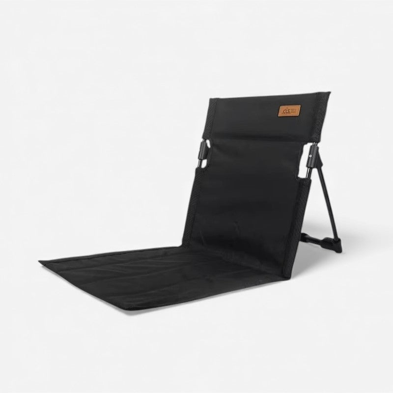 Mivoza foldable outdoor floor chair with back support, ideal for camping and picnics, shown in a garden setting.