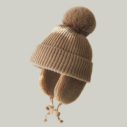 Kids knit beanie winter hat with earflaps by Belro, featuring cozy, colorful knit fabric and warm ear coverage for winter wear.