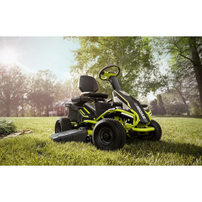 Casavibeo RYOBI 38-inch 100Ah battery electric rear engine riding lawn mower shown outdoors, with cutting deck and ergonomic controls