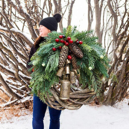 Belro farmhouse Christmas wreath with boho holiday accents, decorated with greenery, pinecones, and rustic ornaments for festive home decor.