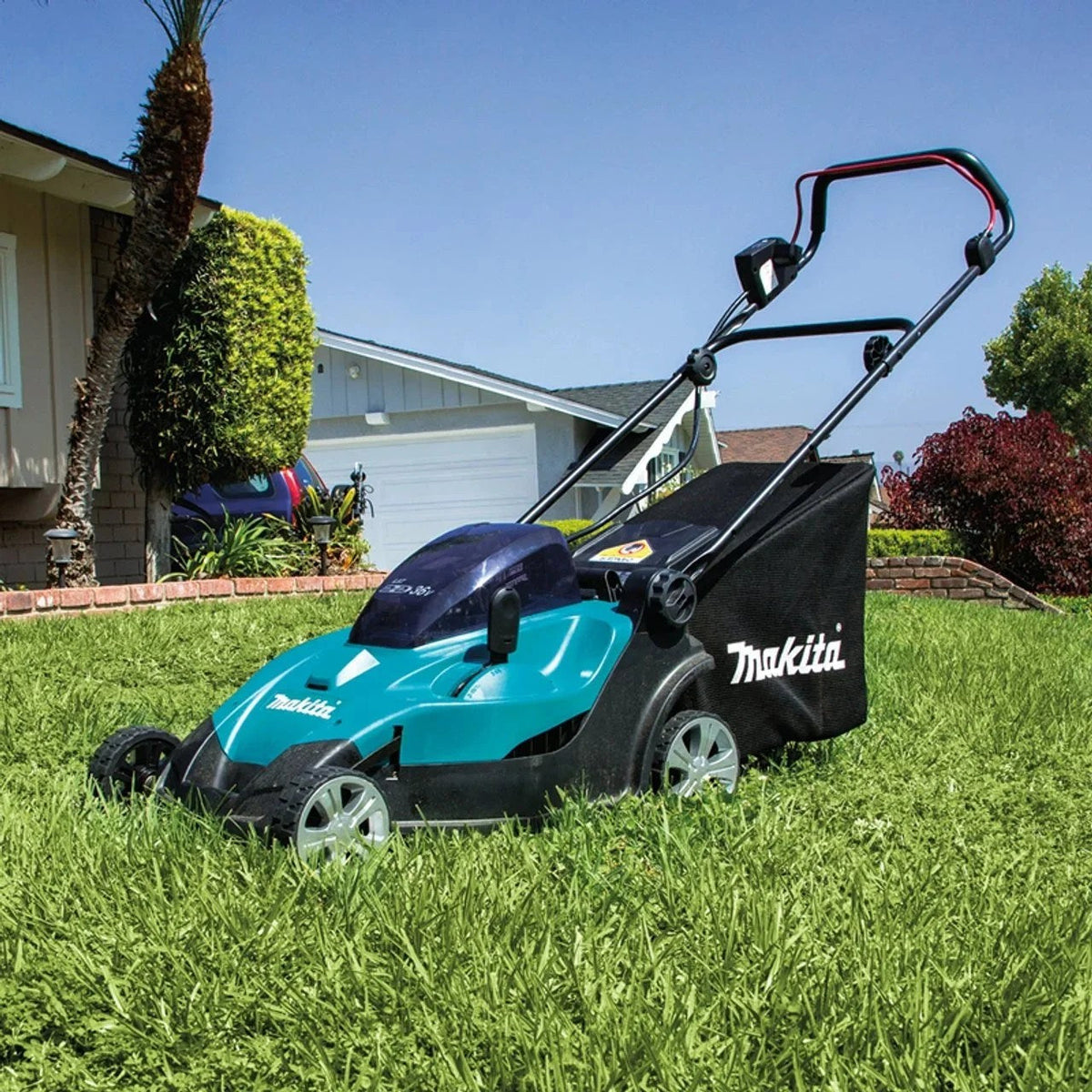Makita 18V X2 (36V) LXT cordless lawn mower with a 17-inch cutting deck, shown in use on a residential lawn