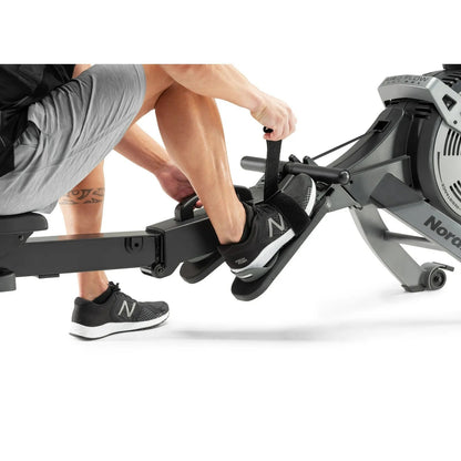 Casavibeo NordicTrack RW600 rowing machine with adjustable seat and digital display, positioned on a gym floor.