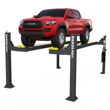 Casavibeo BENDPAK 14,000 lb capacity vehicle lift with turnplates and slip plates, shown in a professional workshop setting.
