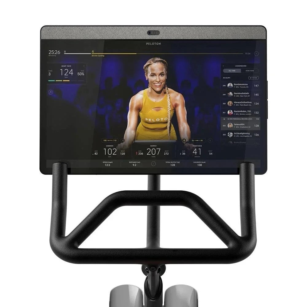 Casavibeo Peloton Bike+ indoor stationary exercise bike with 24-inch HD touchscreen display, sleek design, and adjustable seat.