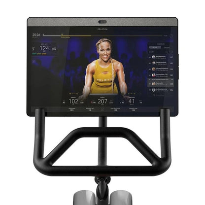 Casavibeo Peloton Bike+ indoor stationary exercise bike with 24-inch HD touchscreen display, sleek design, and adjustable seat.