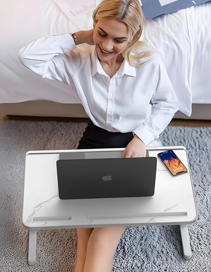 Belro adjustable laptop stand for bed with a sleek design, featuring a sturdy surface and adjustable height for comfortable working.
