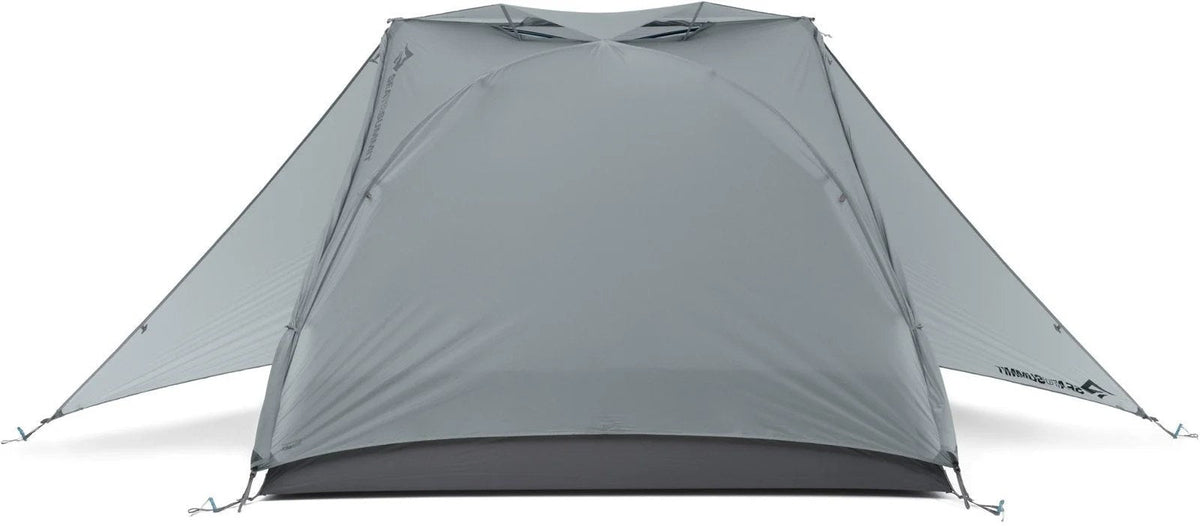 Sea to Summit Telos TR3 tent set up outdoors, showing lightweight camping tent with rainfly and mesh panels for ventilation.