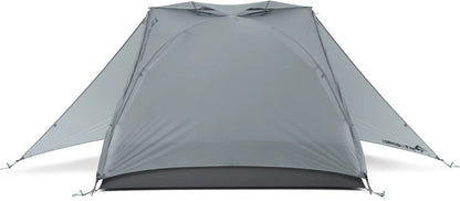 Sea to Summit Telos TR3 tent set up outdoors, showing lightweight camping tent with rainfly and mesh panels for ventilation.