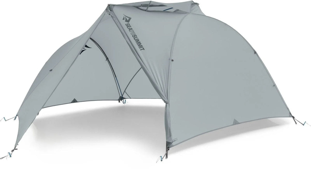 Sea to Summit Telos TR3 tent set up outdoors, showcasing its lightweight, three-person design with rainfly and ventilation features.