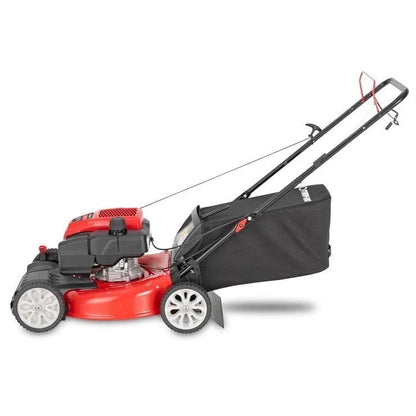 Casavibeo Troy-Bilt TB200C self-propelled lawn mower with green grass, showing the cutting deck and grass collection bag.