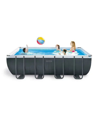 Intex Ultra XTR above ground pool with clear water and a solar cover, set up outdoors in a backyard.
