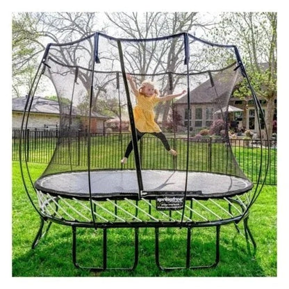 Springfree Compact Oval Trampoline by Casavibeo with safety enclosure and padded edges, set up outdoors on a grassy area.
