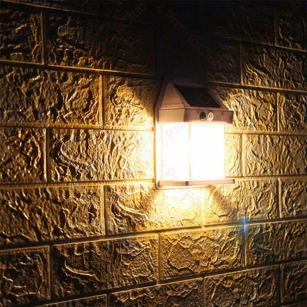 Pair of Mivoza solar wall lanterns with motion sensors, outdoor garden lighting, auto on/off, mounted on exterior wall.