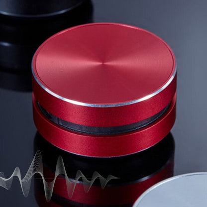 Belro Bone Induction Speaker mounted on a surface, showing its sleek design and contact points for turning surfaces into audio speakers.