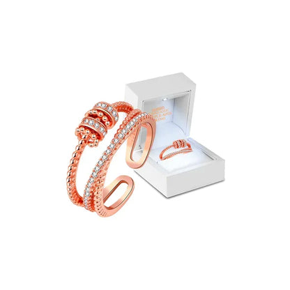 Belro Threanic Triple-Spin Ring, silver-tone jewelry accessory with three interconnected spinning bands.