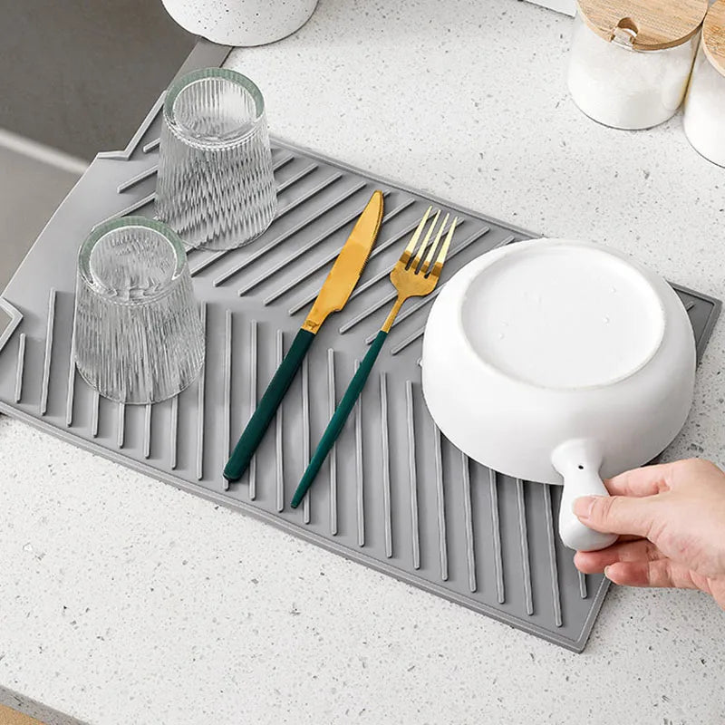 Belro silicone countertop dish drying mat on kitchen counter, flexible and non-slip surface for drying dishes and utensils.