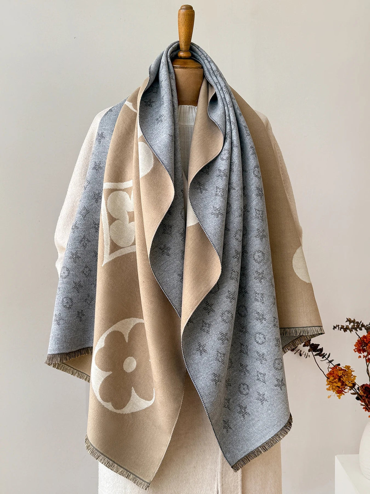 Belro luxury faux cashmere winter scarf and neck warmer in soft, cozy beige with fringed edges, stylishly draped.