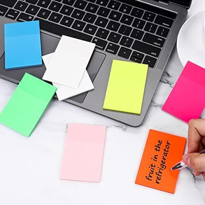 Clear Belro sticky notes on a white surface, showing their transparency and sticky backing for office and stationery use.