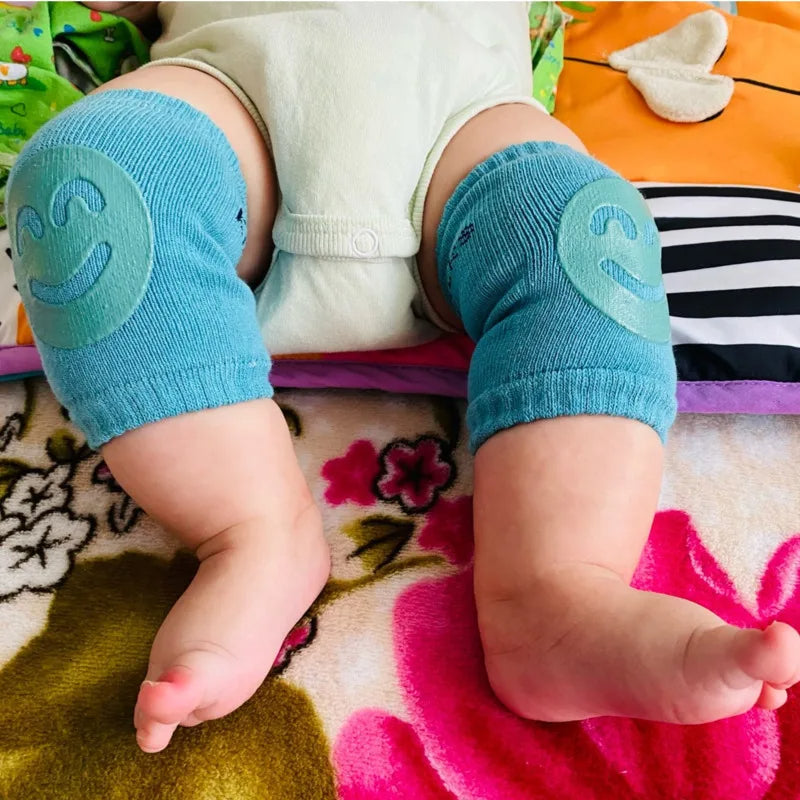 Set of three Belro baby knee pads in colorful, soft fabric designed for crawling and protecting baby's knees.