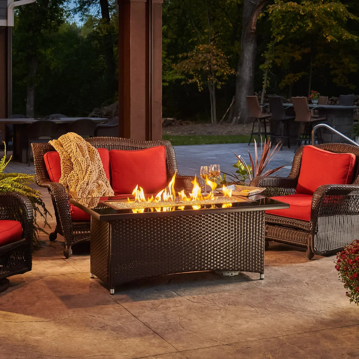 Casavibeo Montego Linear Gas Fire Pit Table with glowing flames, modern design, and sturdy outdoor table surface.