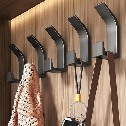 Set of five Belro self-adhesive wall hooks for coats, mounted on a wall for convenient home storage and organization.