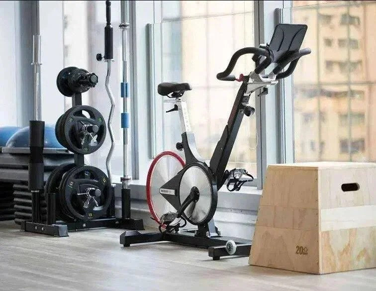 Casavibeo M3 indoor bike with adjustable seat and handlebars, digital display, and sturdy frame for indoor cycling workouts.
